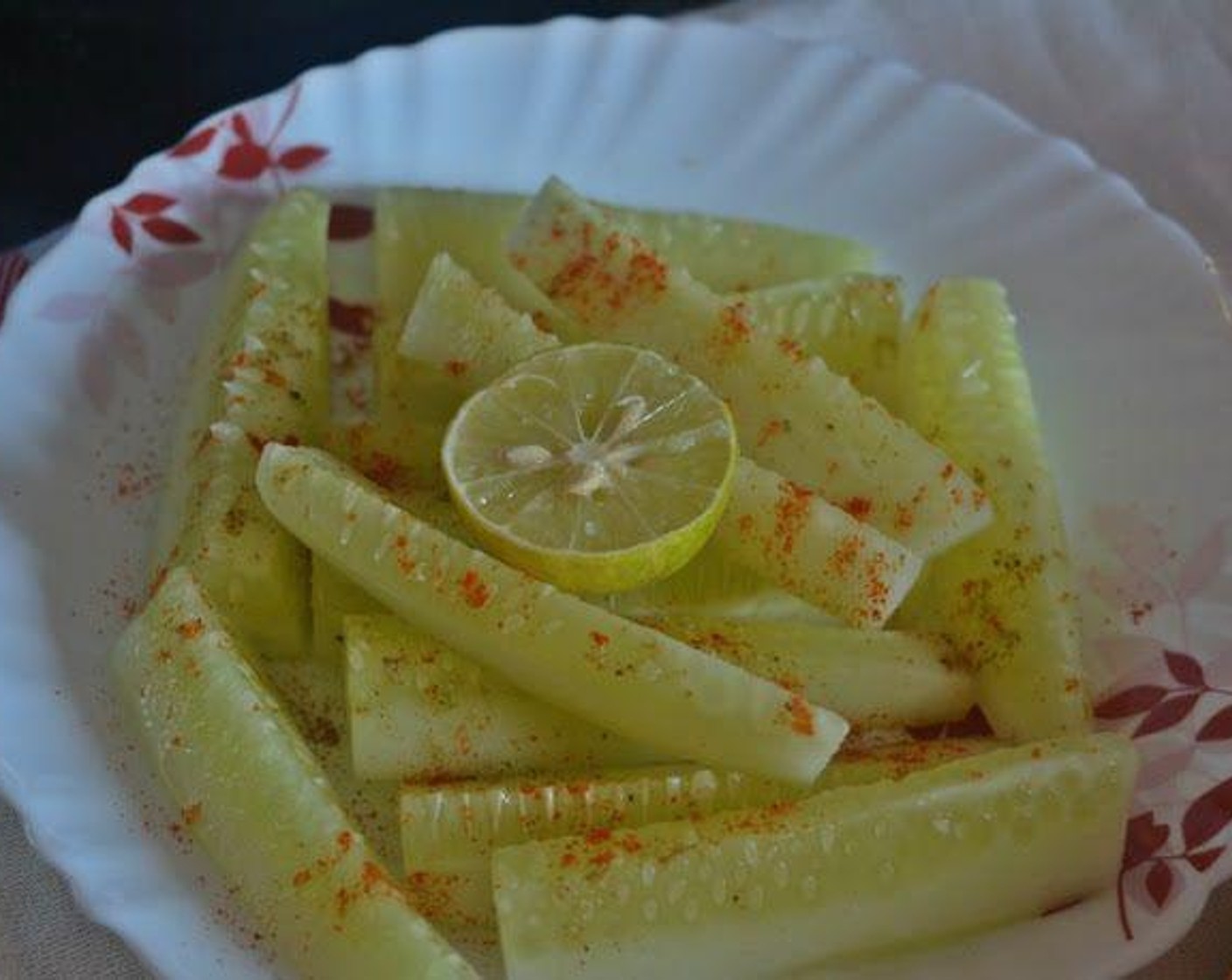 step 1 Sprinkle Smoked Salt (to taste), Red Chili Peppers (to taste), and Lemon Juice (to taste) on Cucumbers (2), toss it lightly and serve it with your chicken curry.