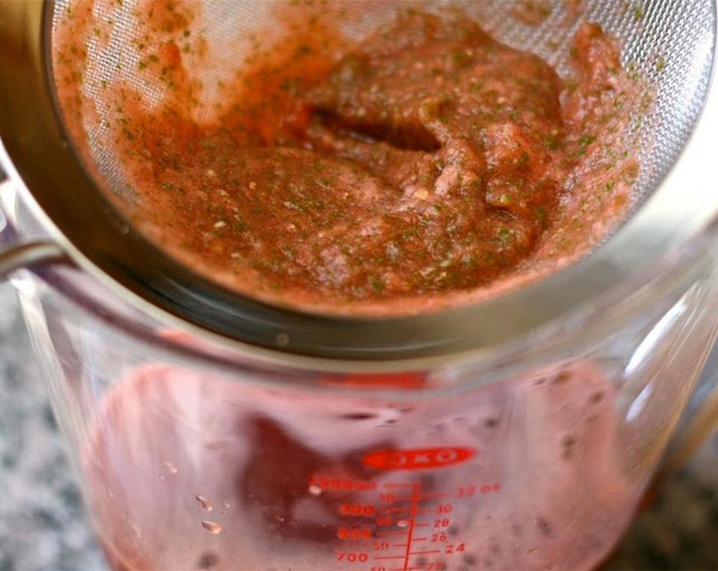step 3 Strain solids through mesh strainer. Pour 1 1/4 to 1 1/2 cups of the watermelon-mint juice into a small saucepan.