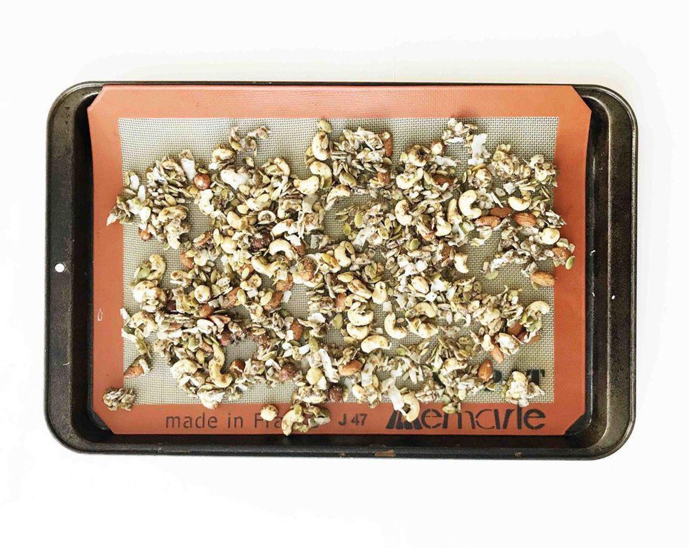 step 3 In a large bowl, add the Raw Cashews (1/2 cup), Raw Almonds (1/2 cup), Coconut Flakes (1/2 cup), Pepitas (1/3 cup), Raw Sunflower Seeds (1/3 cup), Flaxseed Meal (4 Tbsp), Honey (4 Tbsp), melted coconut butter, Chia Seeds (1 Tbsp), and Vanilla Extract (1/2 tsp).
