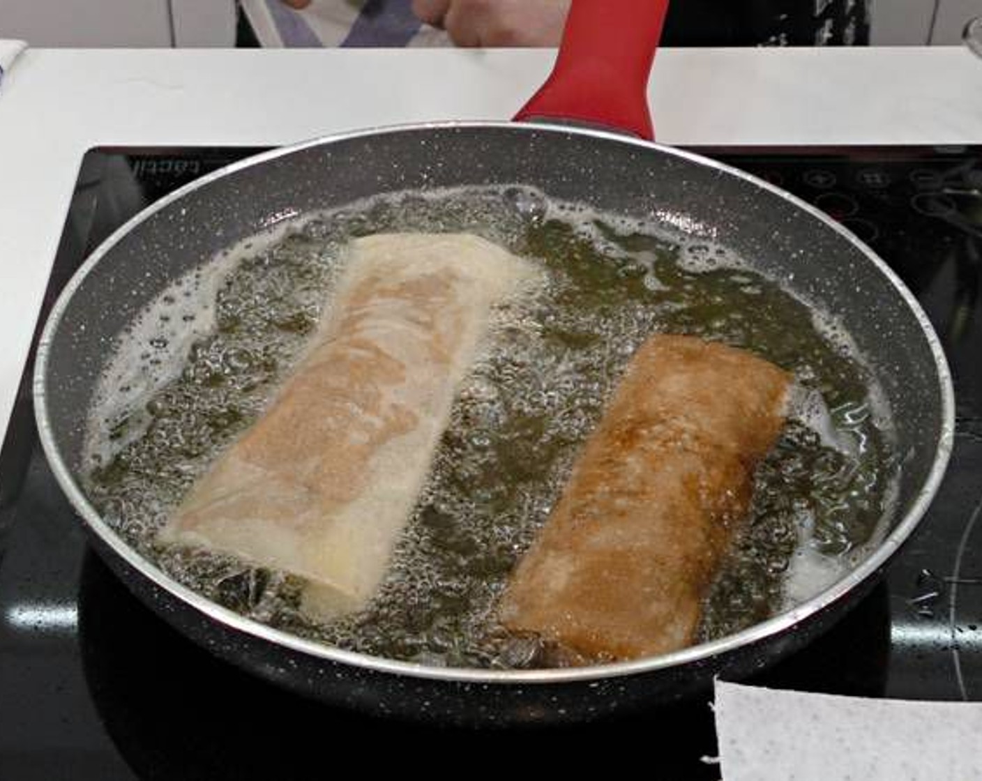 step 14 As you roll them fry them in a large pan filled with Olive Oil (as needed) on high heat.