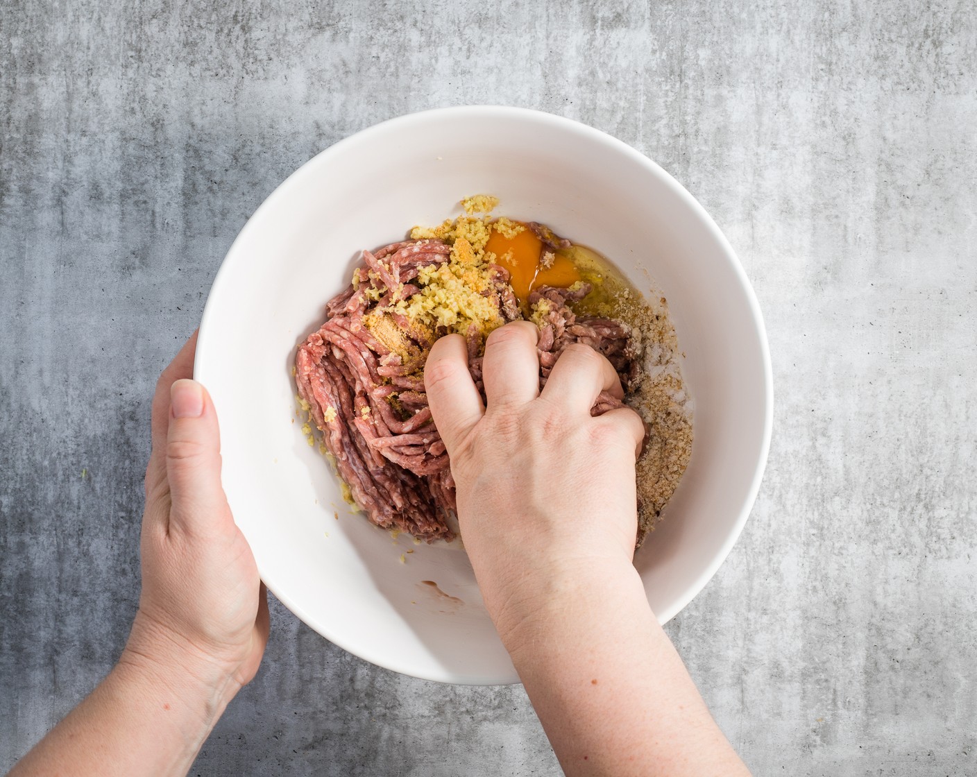 step 2 Make the meatballs. In a large bowl, mix the Ground Beef (1 lb), Breadcrumbs (1/2 cup), Simply Organic Garlic Powder (1 tsp), Kosher Salt (1/2 tsp), Eggland's Best Classic Egg (1), Milk (2 Tbsp), and Fresh Ginger (1 piece). Combine well with your hands, then form the mixture into 16 large meatballs; each meatball will be about 1 1/2 Tbsp of the mixture.