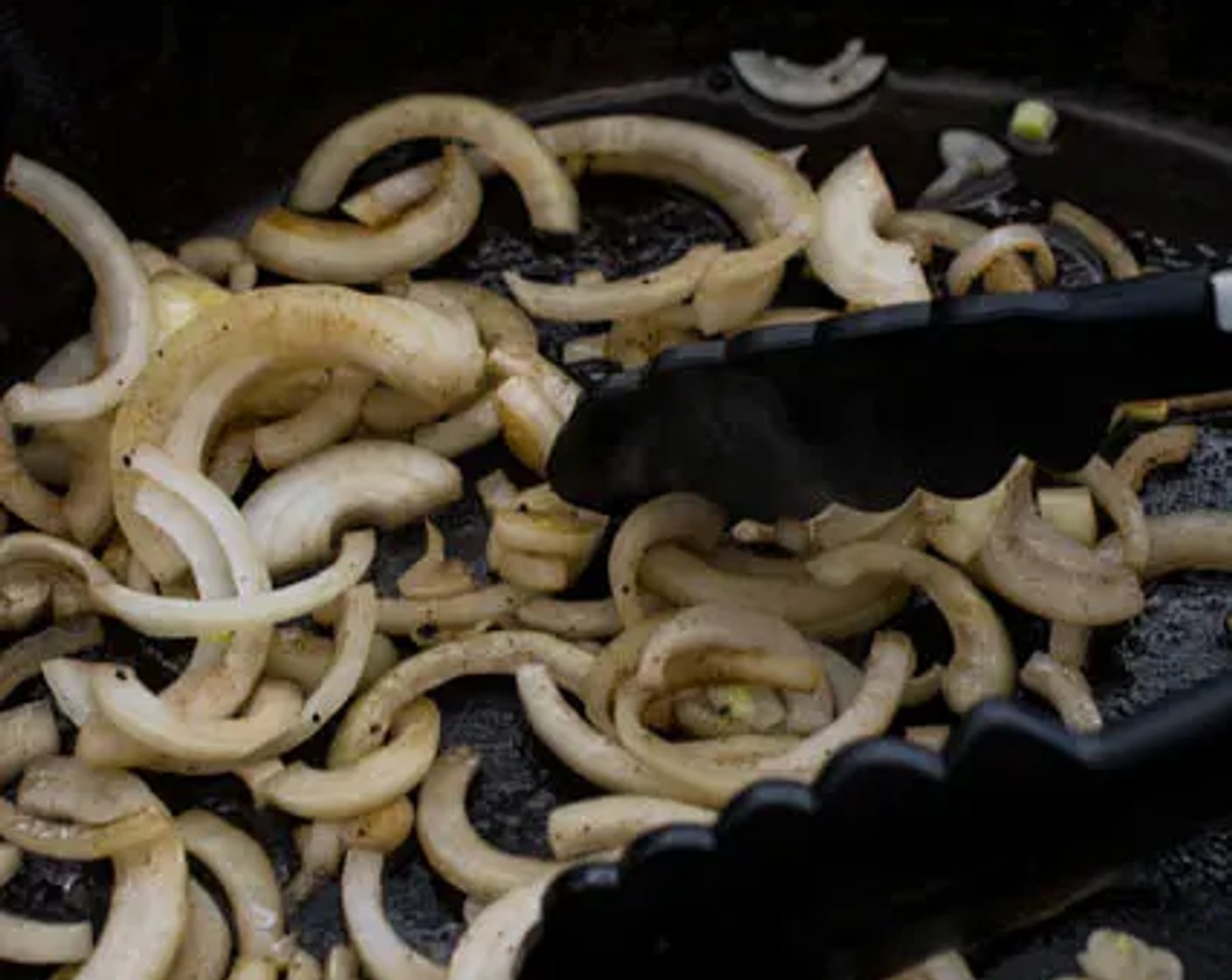 step 4 Heat a cast-iron skillet (or a wok) over high heat. Pour Cooking Oil (2 Tbsp) into the skillet, then add Onion (1). Saute the onions for about 2 minutes or until slightly soft. Remove from the skillet and set them aside.