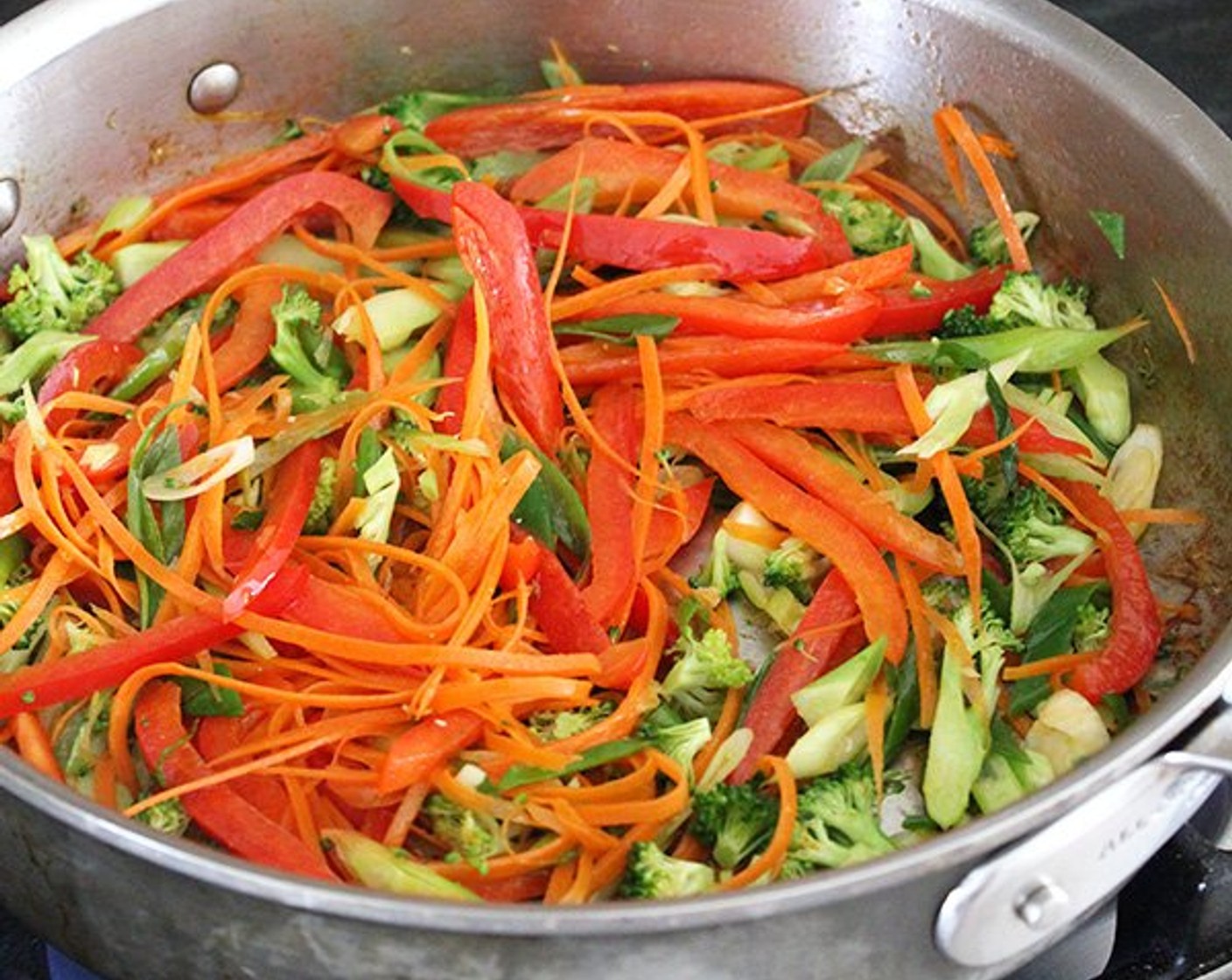 step 5 Add Mixed Vegetables (1 cup) and Scallion (1 bunch) to the pan. Cook, tossing occasionally, until just tender, about 3 minutes.