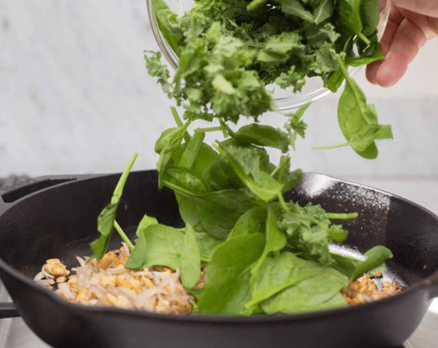 step 7 Add shallot, and cook while stirring until translucent, 3-4 minutes. Stir in Tomato Paste (2 Tbsp) and Salt (1/4 tsp). Add greens and  Water (4 Tbsp), and cook until just wilted. Remove from skillet to cool.