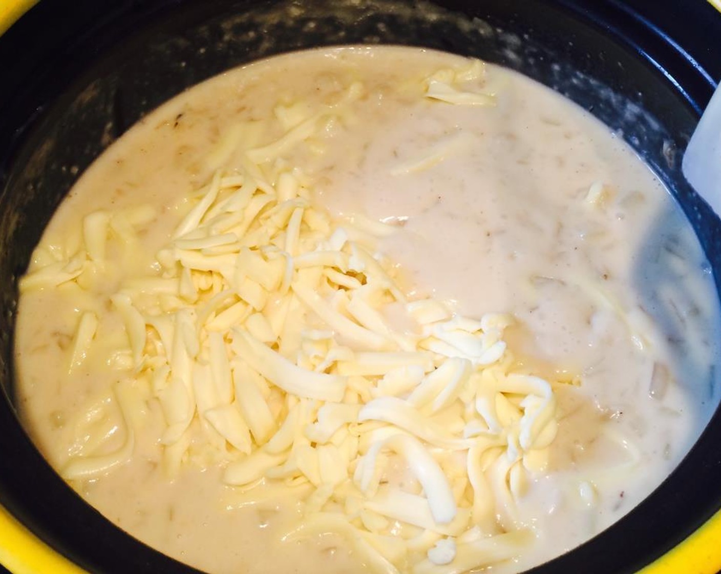 step 11 Bring to a boil; cook and stir for 1-2 minutes or until thickened. Add more water if you prefer a thinner consistency. Lower heat, stir in clam meat and Shredded Cheese (1/4 cup).