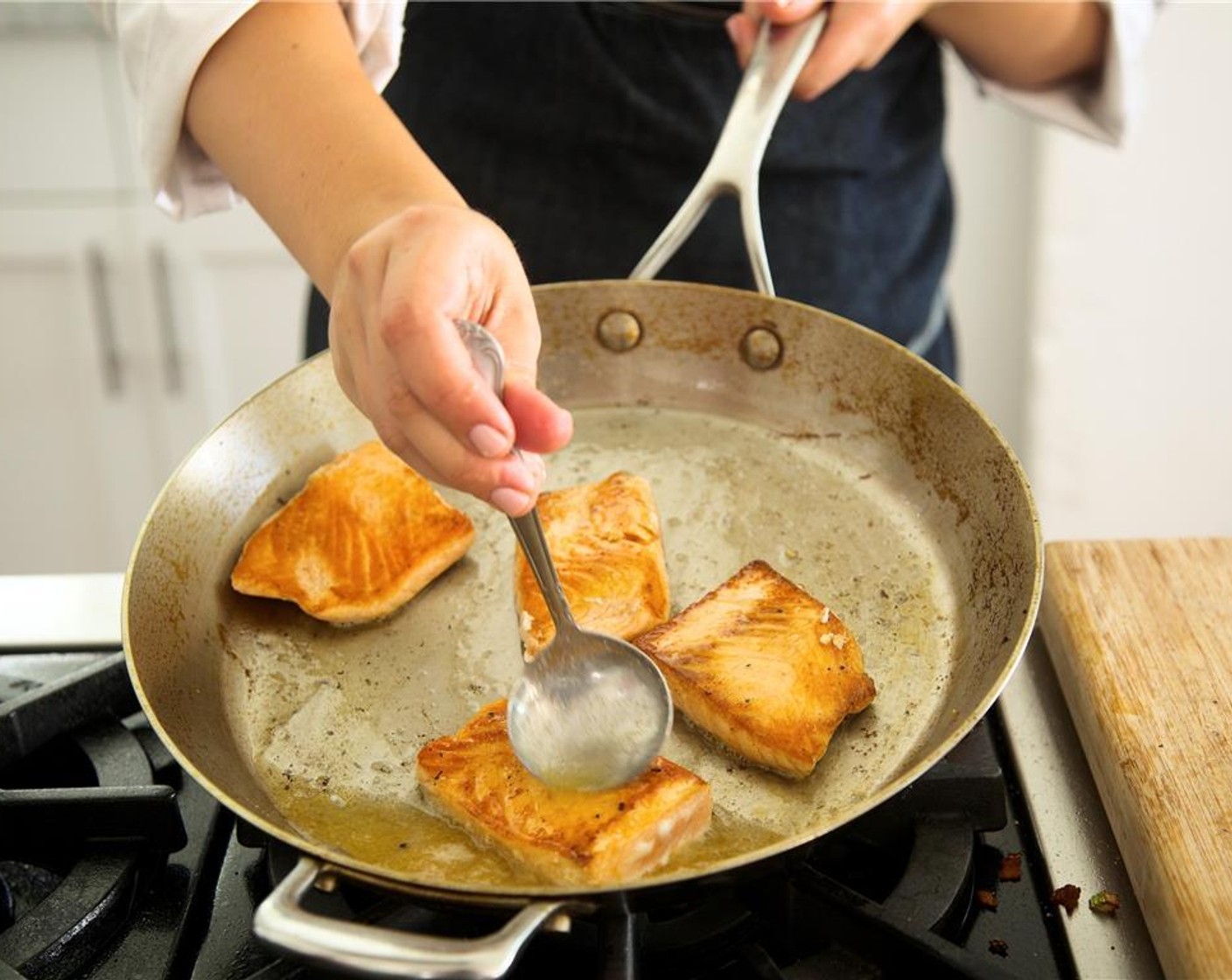 step 16 Flip fish gently and pour in lemon juice. Using a spoon, baste fish continuously with lemon juice and butter mixture and cook for three more minutes until center is opaque and cooked through. Remove pan from heat until plating.