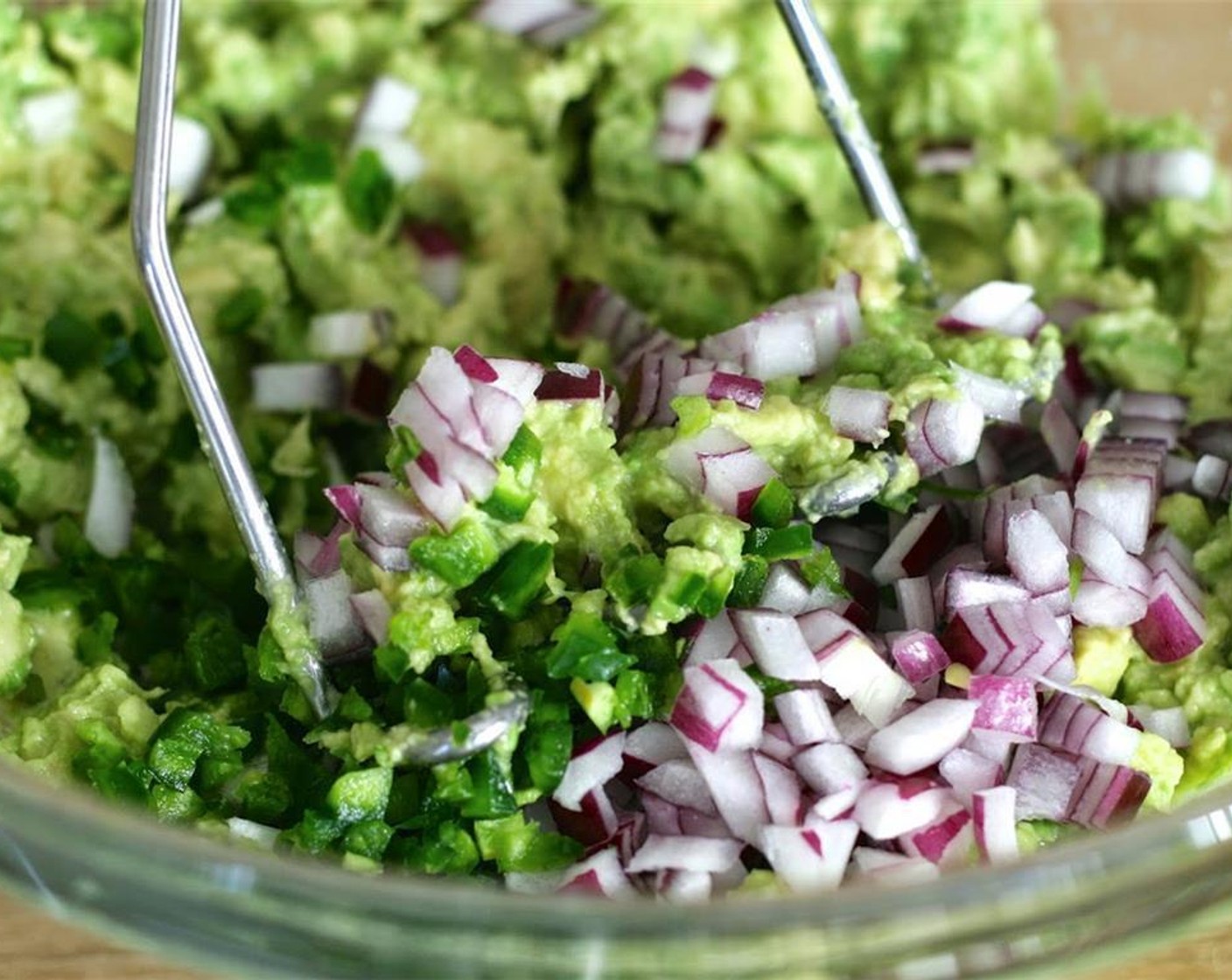 step 2 Next, add the Red Onion (1/2 cup) and Jalapeño Pepper (1), then mash into the avocado. Stir in the Fresh Cilantro (1/2 cup) and season with Kosher Salt (to taste).