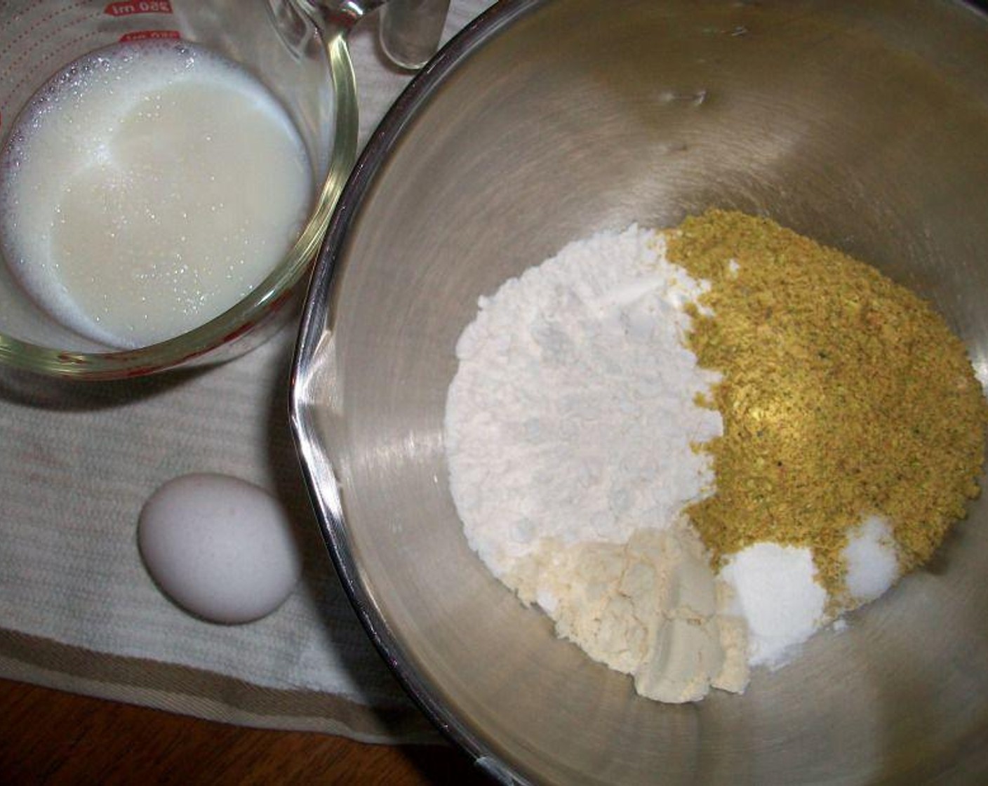 step 1 In a large bowl, whisk Pistachios (1/2 cup), All-Purpose Flour (1 cup), Protein Powder (1 scoop), Baking Powder (1 tsp), and Salt (1/4 tsp).