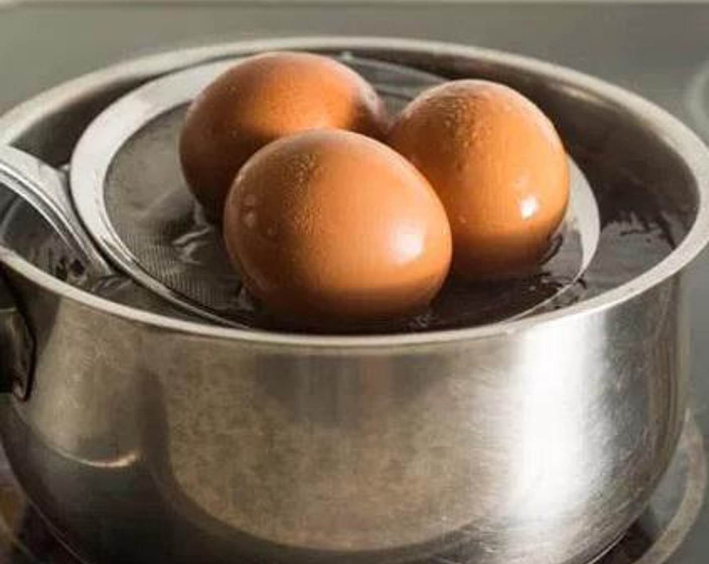 step 2 Slowly add the Eggland's Best Classic Eggs (6) into the boiling water using a large spoon or soup skimmer. Allow to cook for 7 minutes.