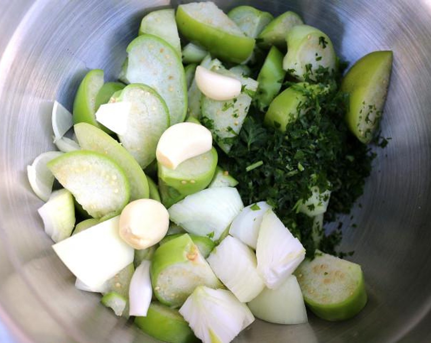 step 1 To the diced Tomatillo (1 lb), add Onion (1), Garlic (4 cloves), Fresh Cilantro (4 Tbsp), Jalapeño Pepper (1 Tbsp), and Kosher Salt (to taste). Blend the mixture until smooth.