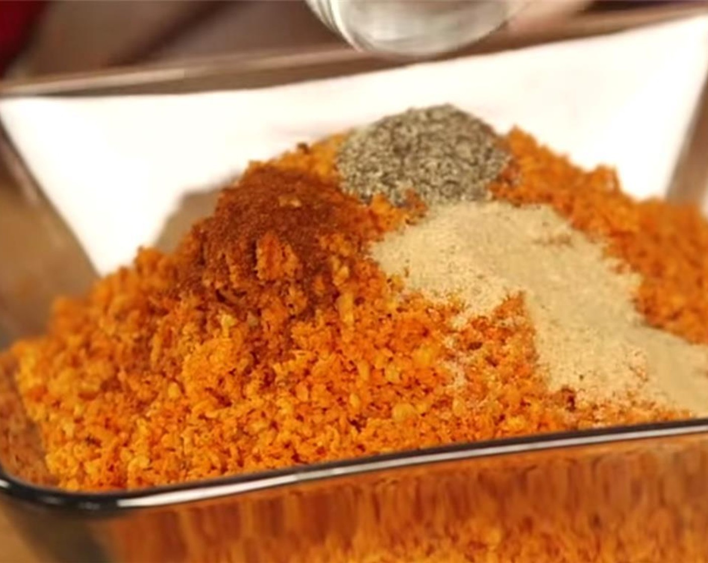step 2 In a food processor, add Doritos® Nacho Cheese Flavored Tortilla Chips (1 1/2 cups), Spicy Nacho Cheese Tortilla Chips (1 1/2 cups), Paprika (1 tsp), Ground Black Pepper (1 tsp), and McCormick® Garlic Powder (1/2 Tbsp), and pulse until it resembles coarse breadcrumbs.