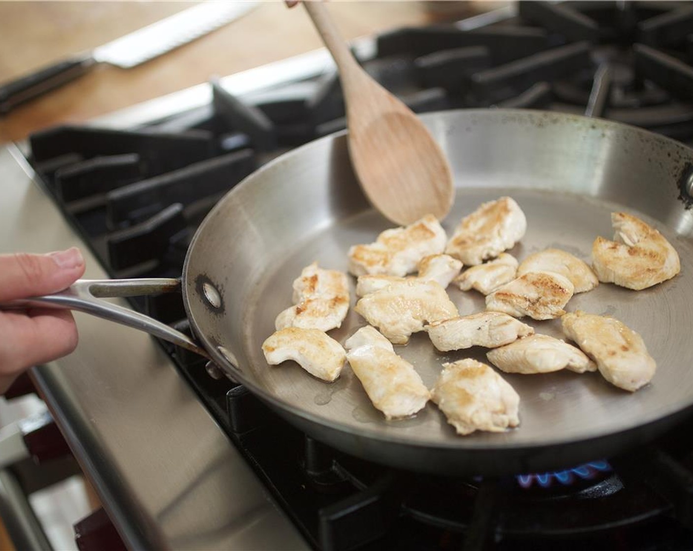 step 5 In a saute pan, heat 2 teaspoons of canola oil over medium-high heat. When the oil is hot, add the chicken and cook for 3 minutes, stirring occasionally. Remove chicken from the pan and set aside.