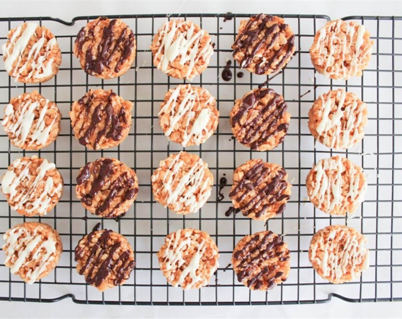 step 5 Cover a work surface with parchment. Place a wire rack on top. Loosen the bites with a butter knife and transfer to the rack. Place the chopped Dark Chocolate (3 Tbsp) in a microwave safe bowl and microwave in 15-second bursts, until melted. Drizzle each bite with chocolate.