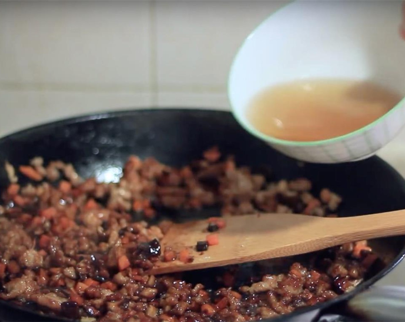 step 7 Add Salt (1 pinch), Dark Soy Sauce (1 Tbsp), Granulated Sugar (1 tsp), liquid for soaking mushrooms and Water (1/2 cup). Stir continually.