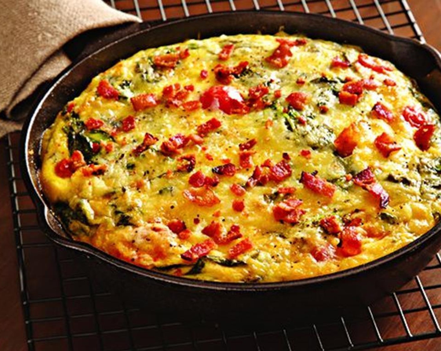 step 6 Bake the frittata until the center is set, 25 to 30 minutes. Let rest on top of the stove before cutting into wedges to serve.