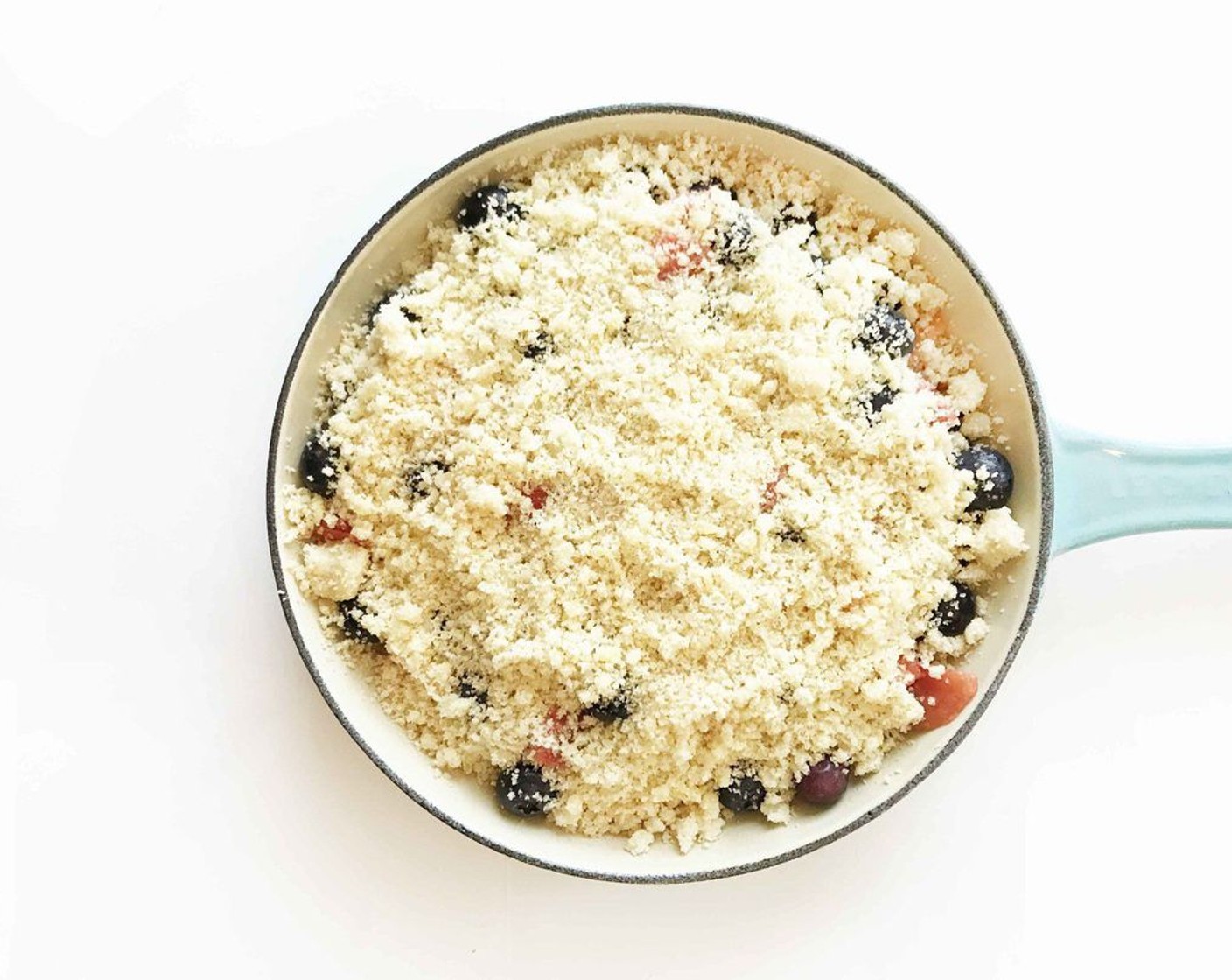 step 9 Sprinkle the flour mixture over the berries and place the skillet in the oven to bake for about 20 minutes, or until the top is browning and the sides are bubbling.