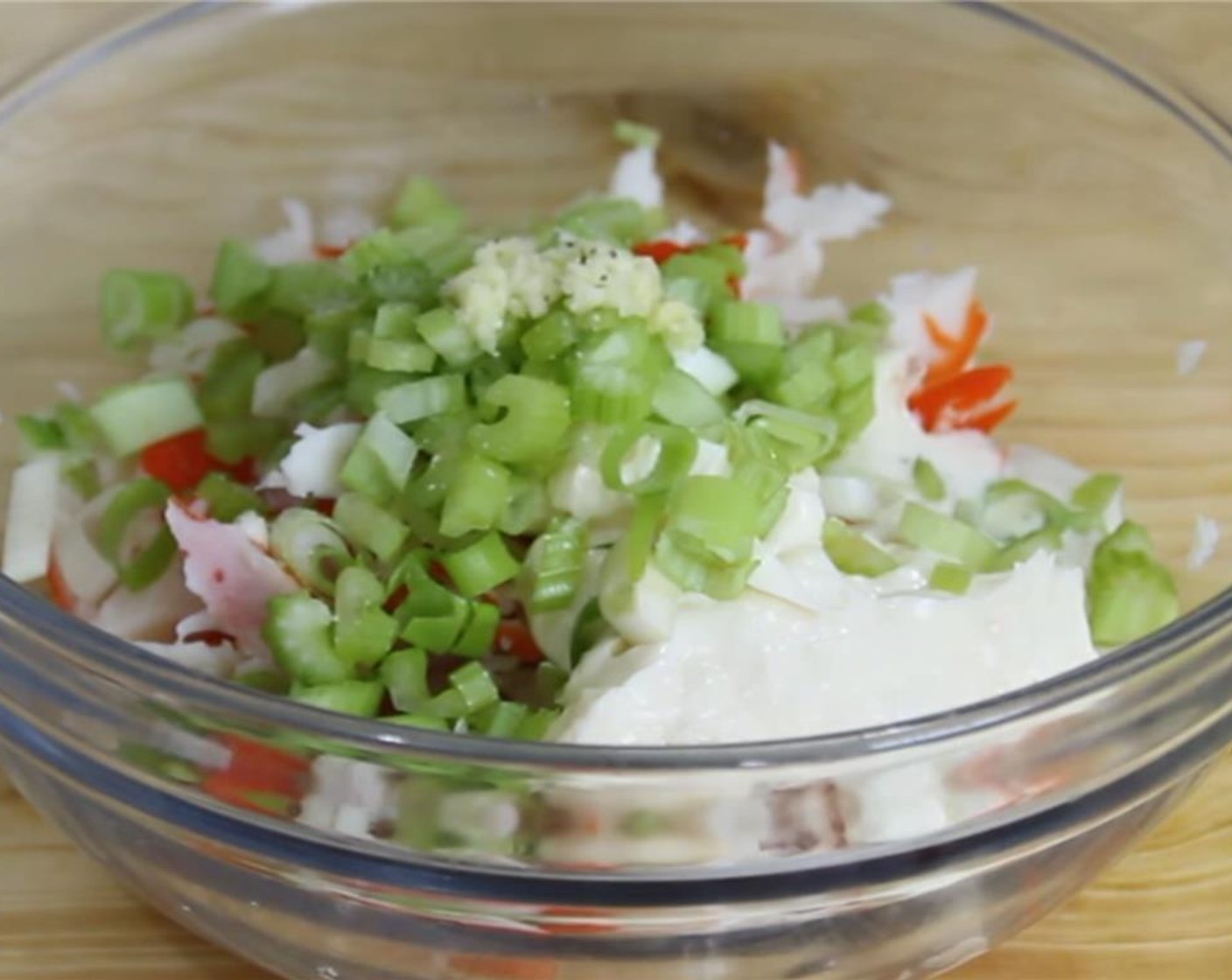 step 2 Add in the Mayonnaise (1/2 cup), Celery (2 stalks), Scallions (2 stalks), Ranch Dressing (4 Tbsp), Garlic (1 clove), and the removed kernels from a Corn Cob (1). Season with Salt (to taste) and Ground Black Pepper (to taste).
