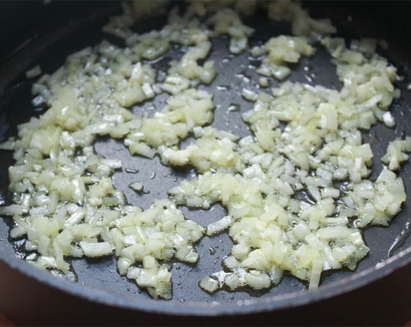 step 9 Heat the remaining Extra-Virgin Olive Oil (2 Tbsp) in a large Dutch oven or saucepan. When hot, add the minced onion and minced garlic and sauté for 2-3 minutes until the onions become translucent.