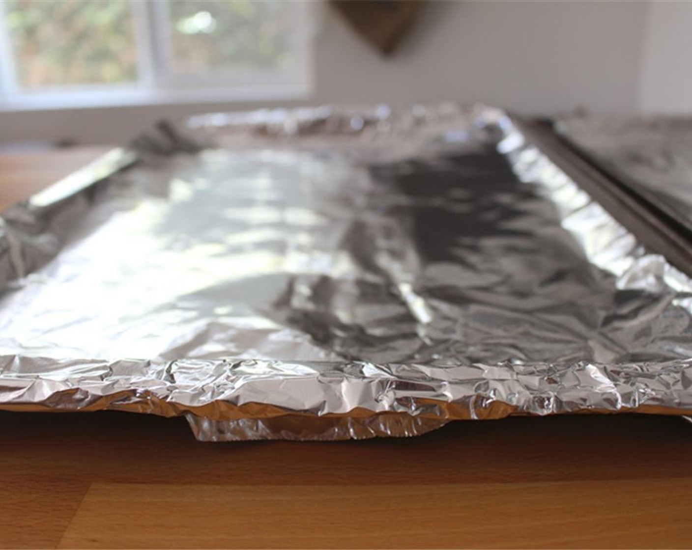 step 1 Preheat oven to 450 degrees F (230 degrees C) and line baking sheet with aluminum foil.
