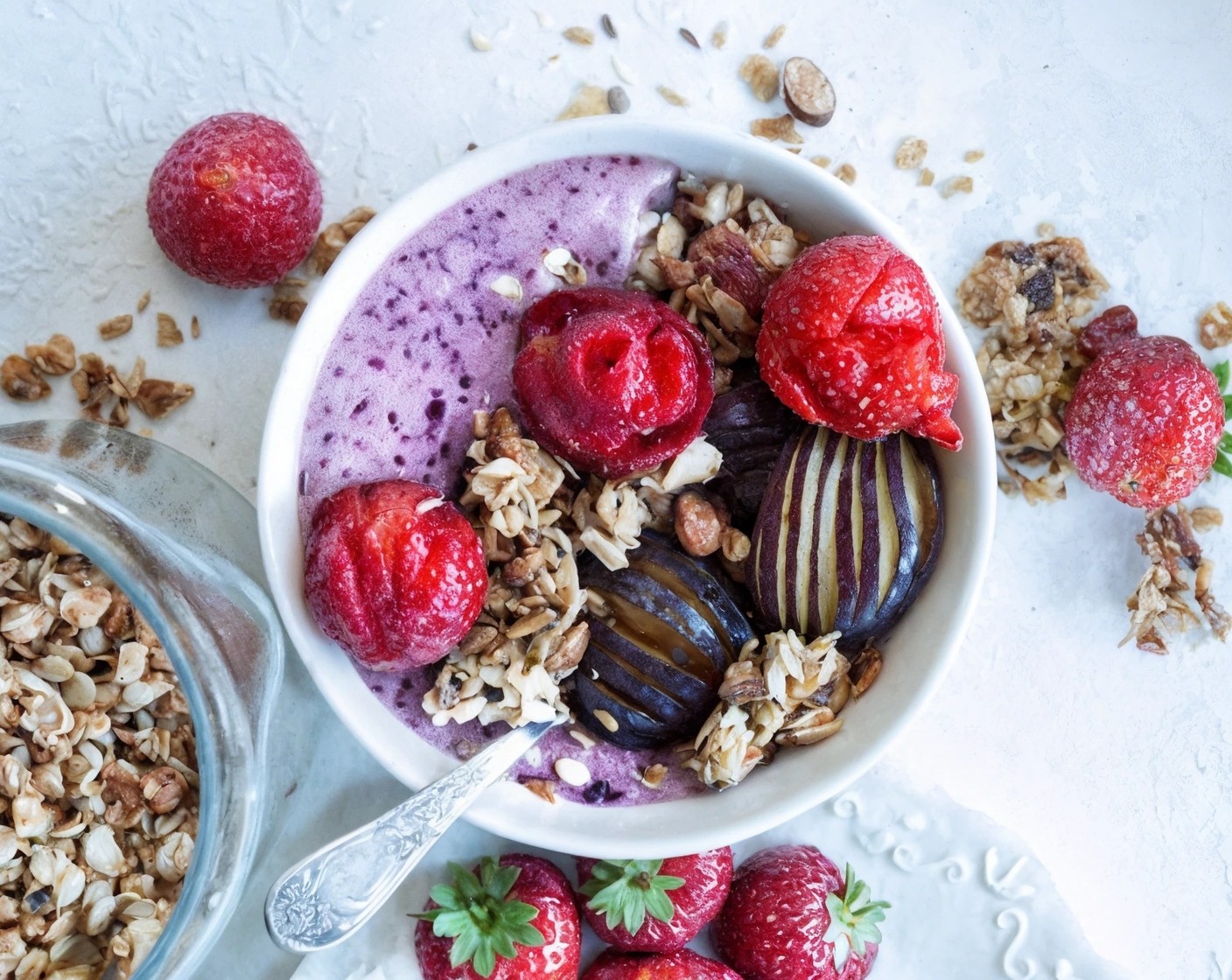 step 2 Decorate with Honey Granola (1 handful), Plums (2), and Fresh Strawberries (to taste). Serve and enjoy!