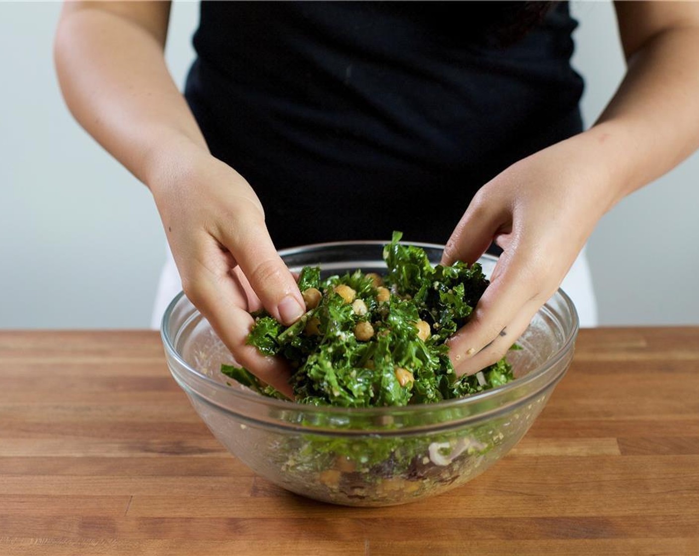 step 11 When the quinoa is finished, add to the bowl with the vinaigrette. Add the Kale (3 1/3 cups), mint leaves, shallots, chickpeas, Dried Cherries (4 Tbsp), Marcona Almonds (3 2/3 Tbsp), and half of the Goat Cheese (3 2/3 Tbsp). Toss to combine.