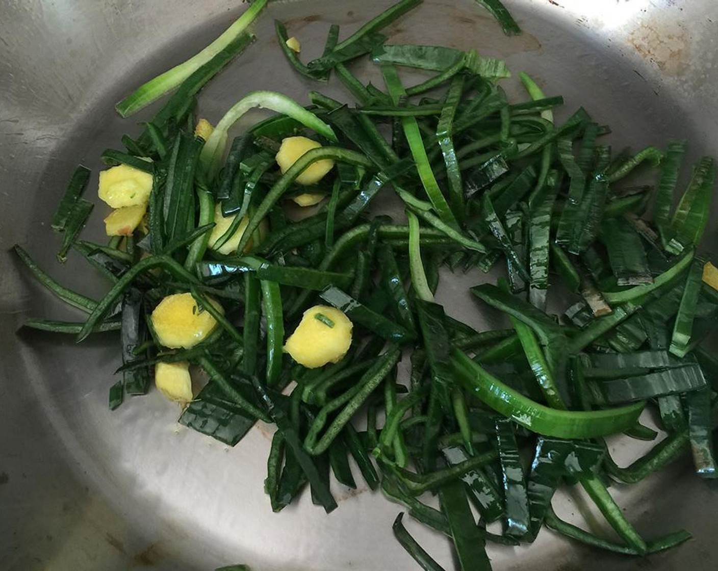 step 5 Heat Oil (3 Tbsp) in a pan over medium heat. Throw in the green part of the thinly sliced leeks and the rest of the ginger. Cook for 5 minutes.