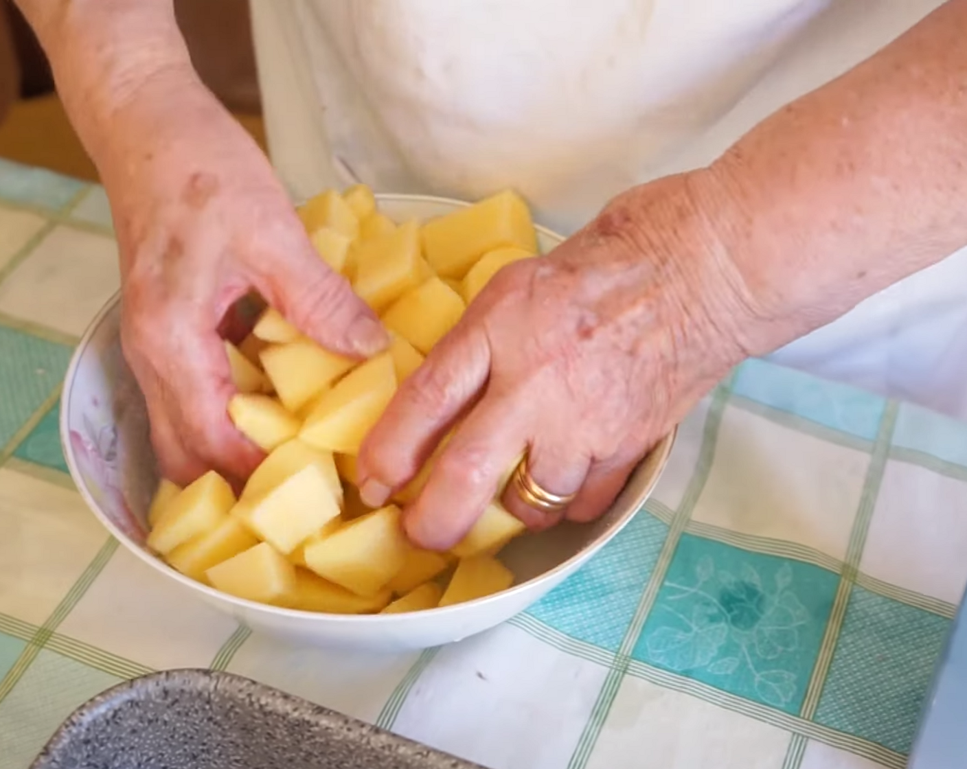 step 3 Sprinkle a few pinches of Salt (to taste) over the potatoes, rubbing it over them really well, mixing it through using your hands.