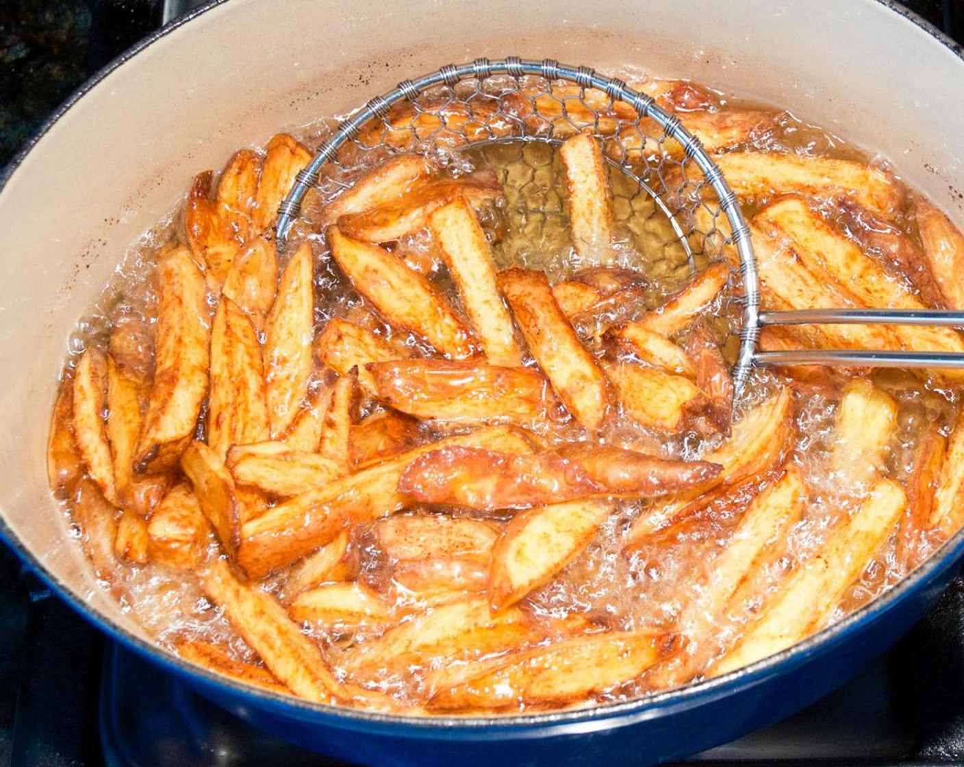 step 6 Cook the potatoes for 25 to 30 minutes until crisp outside and tender inside, stirring occasionally. Meanwhile, line a baking sheet with paper towels and set aside.