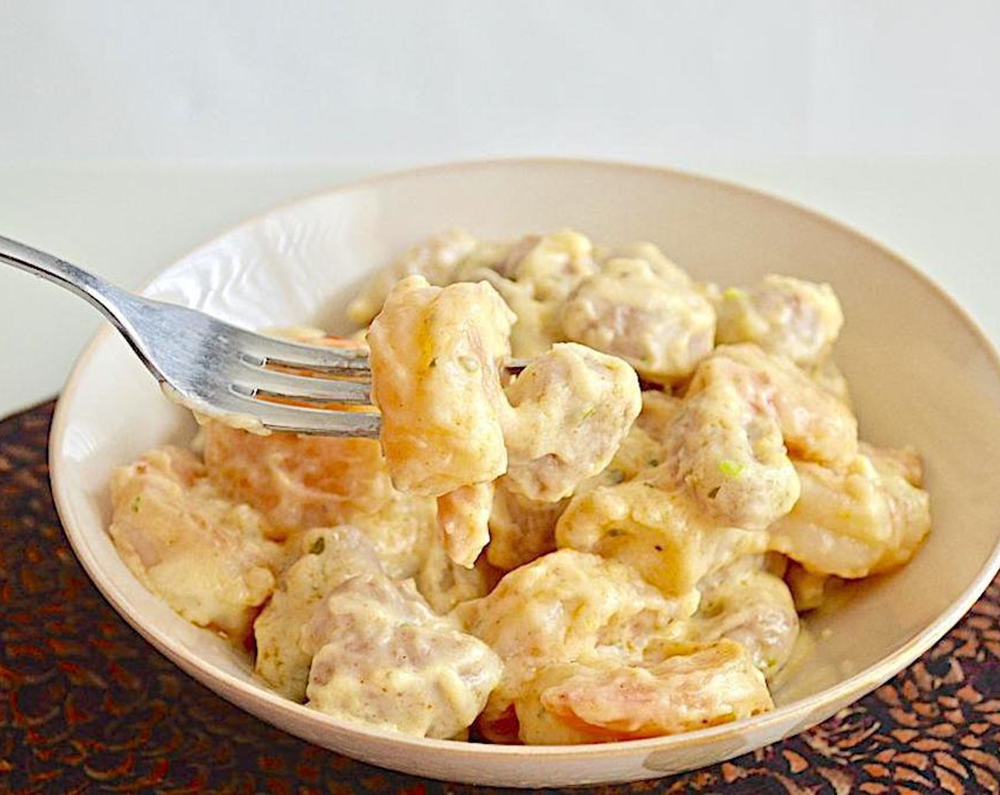 step 5 Then slowly pour in the Half and Half (1/2 cup) and Parmesan Cheese (1/2 cup) while you keep whisking. The sauce should be thick and creamy. Add the gnocchi and shrimp back in to warm them up and toss it all together thoroughly. Serve immediately and enjoy!