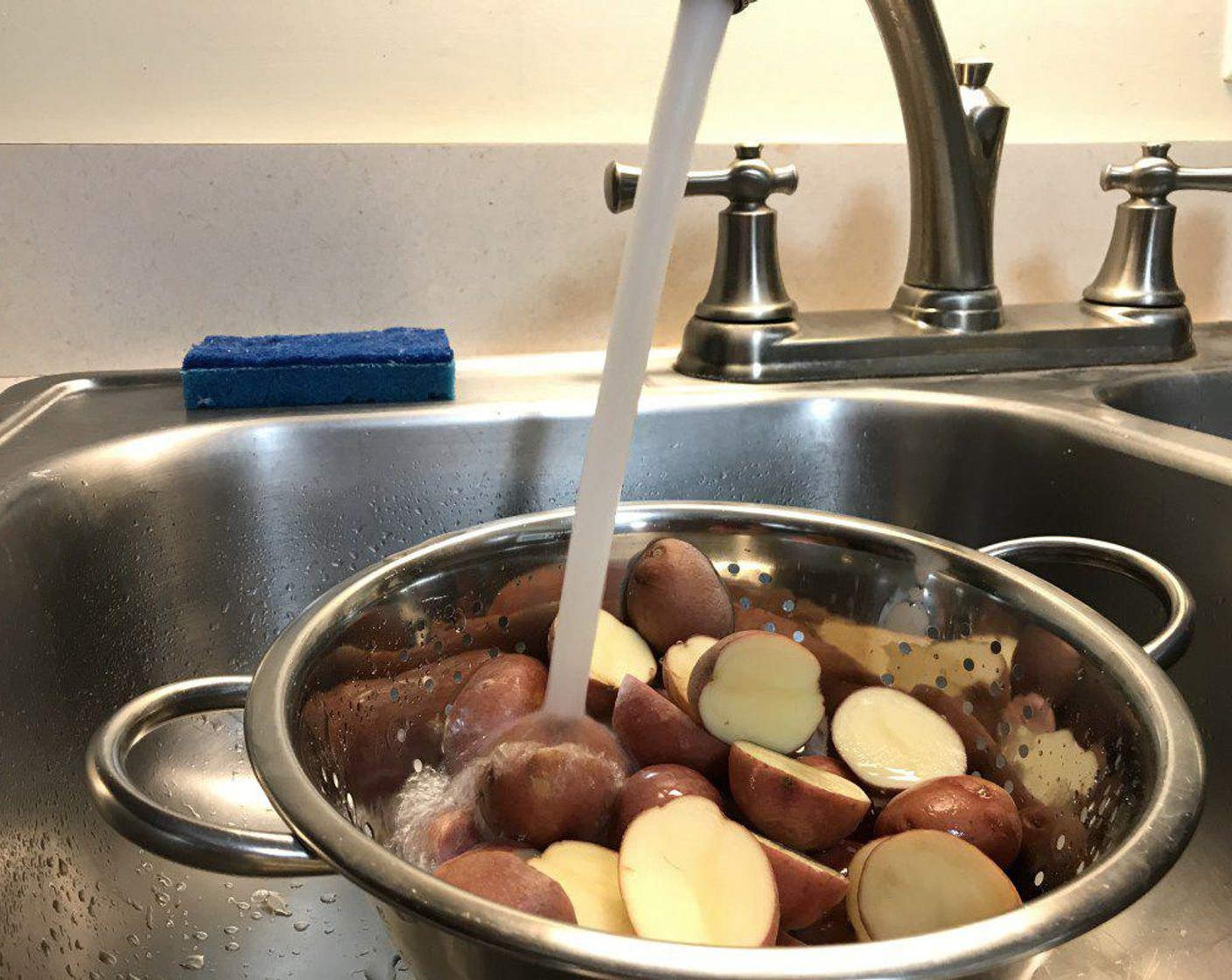 step 2 Rinse potatoes in cold running water.