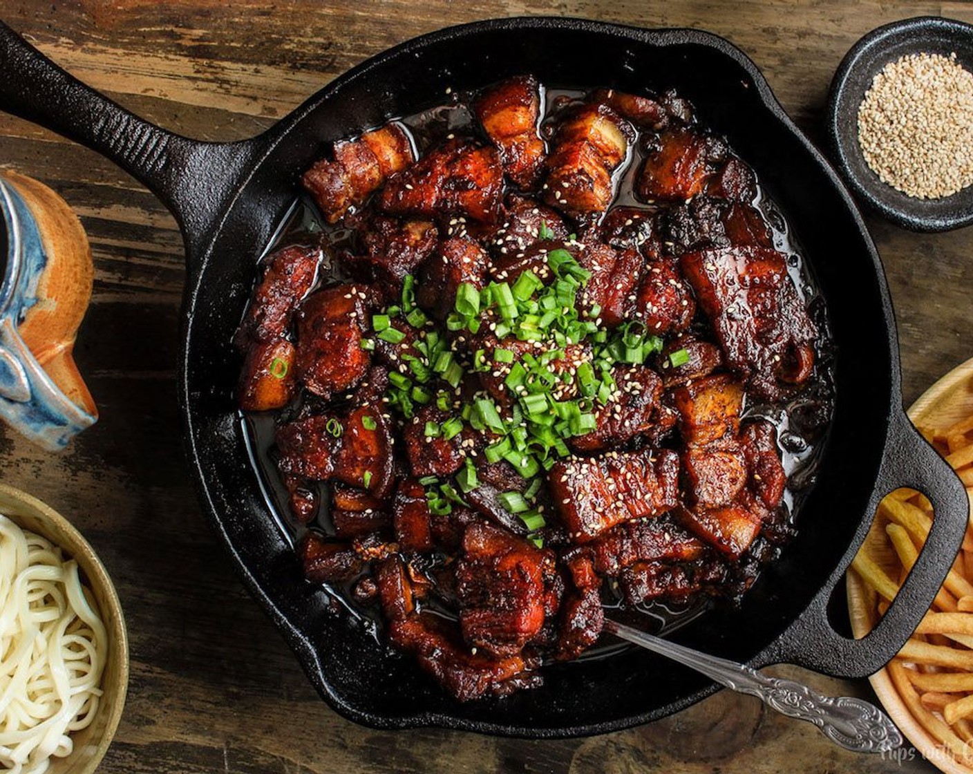 step 8 Serve with white rice, plain noodles or roasted smashed potatoes. Top with Scallions (to taste) and Toasted White Sesame Seeds (to taste). Enjoy!