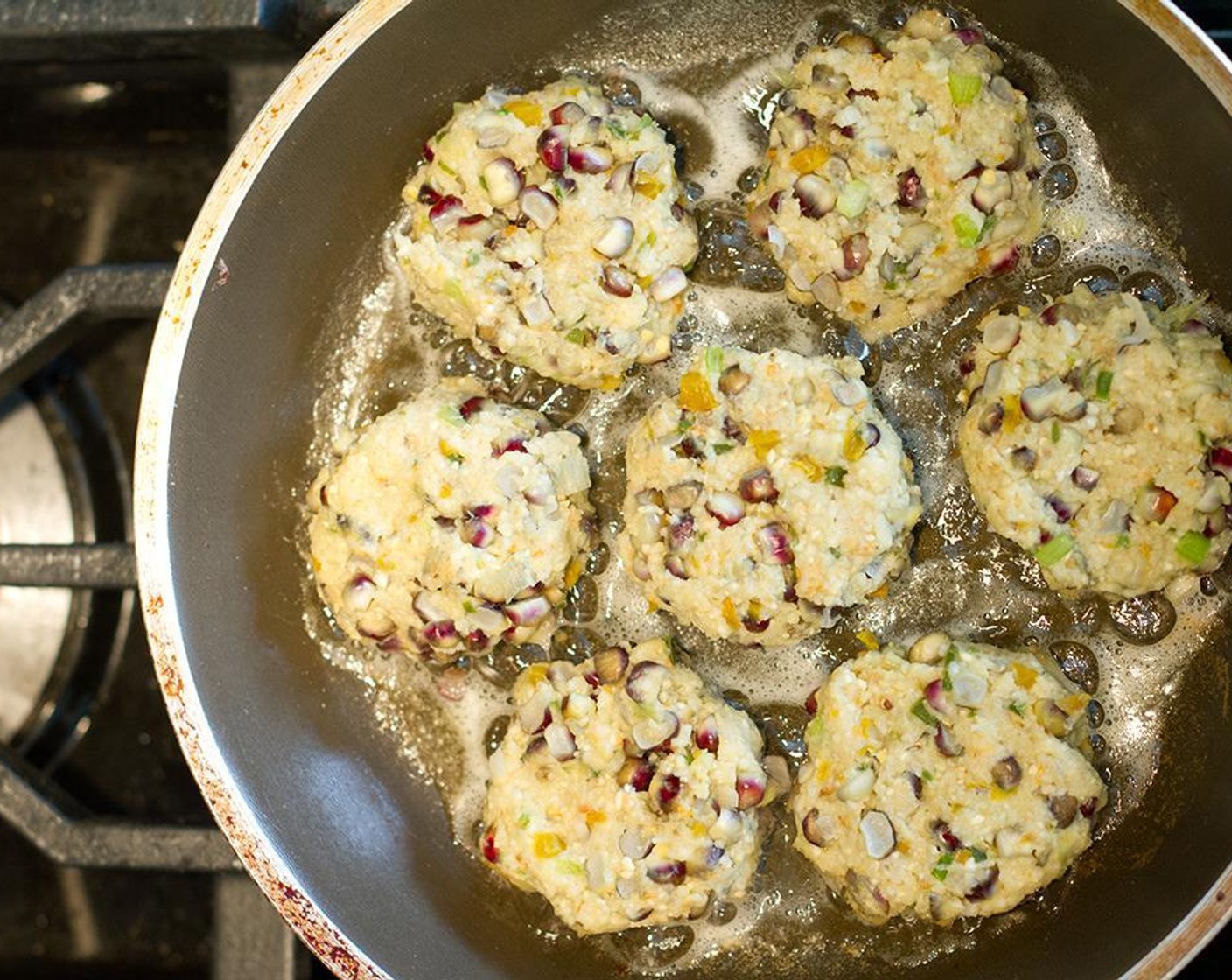 step 11 Brown over medium heat, about 2 minutes per side. If all the corn cakes don't fit in to the pan, keep the corn cakes crisp on a baking sheet by placing them in an oven preheated to 200 degrees F (95 degrees C).