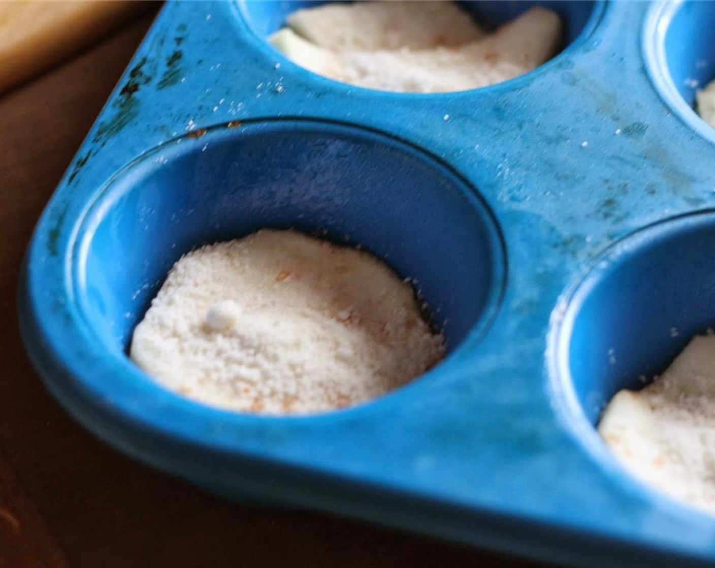 step 4 Sprinkle another teaspoon of Parmesan and a little mozzarella cheese over each eggplant slice.