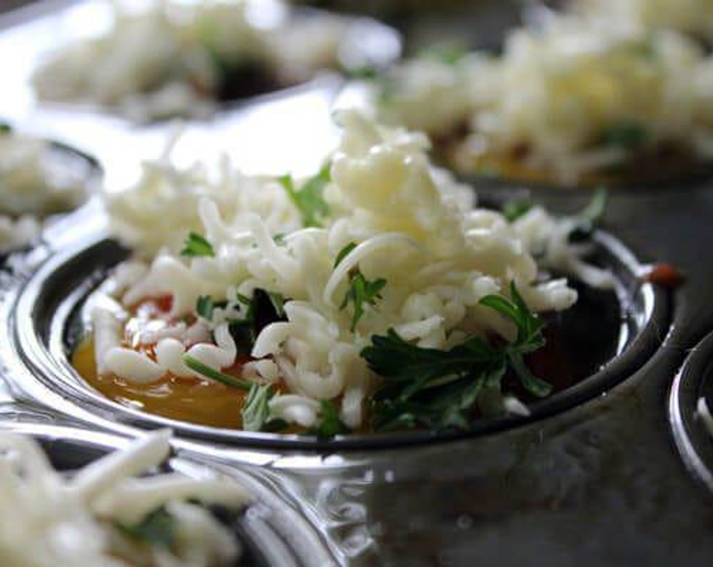 step 6 Top the egg cups evenly with the Monterey Jack Cheese (1 cup) and Fresh Parsley (2 Tbsp).