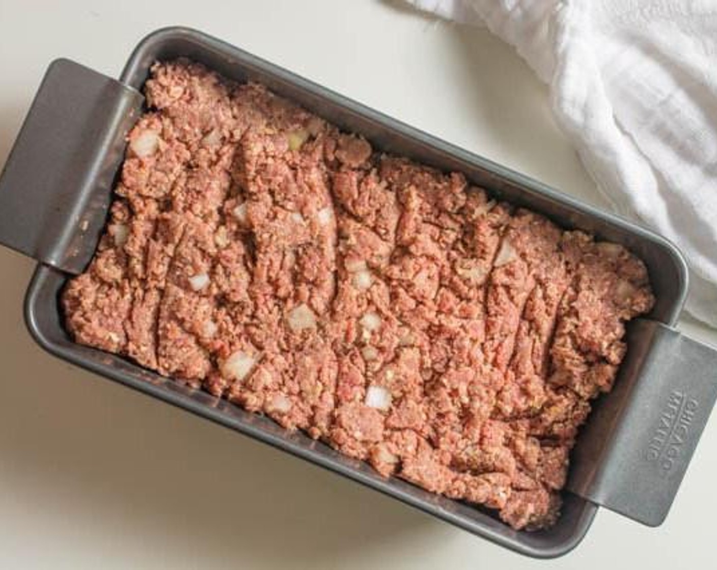 step 3 Put meat mixture in meatloaf pan or a regular loaf pan.