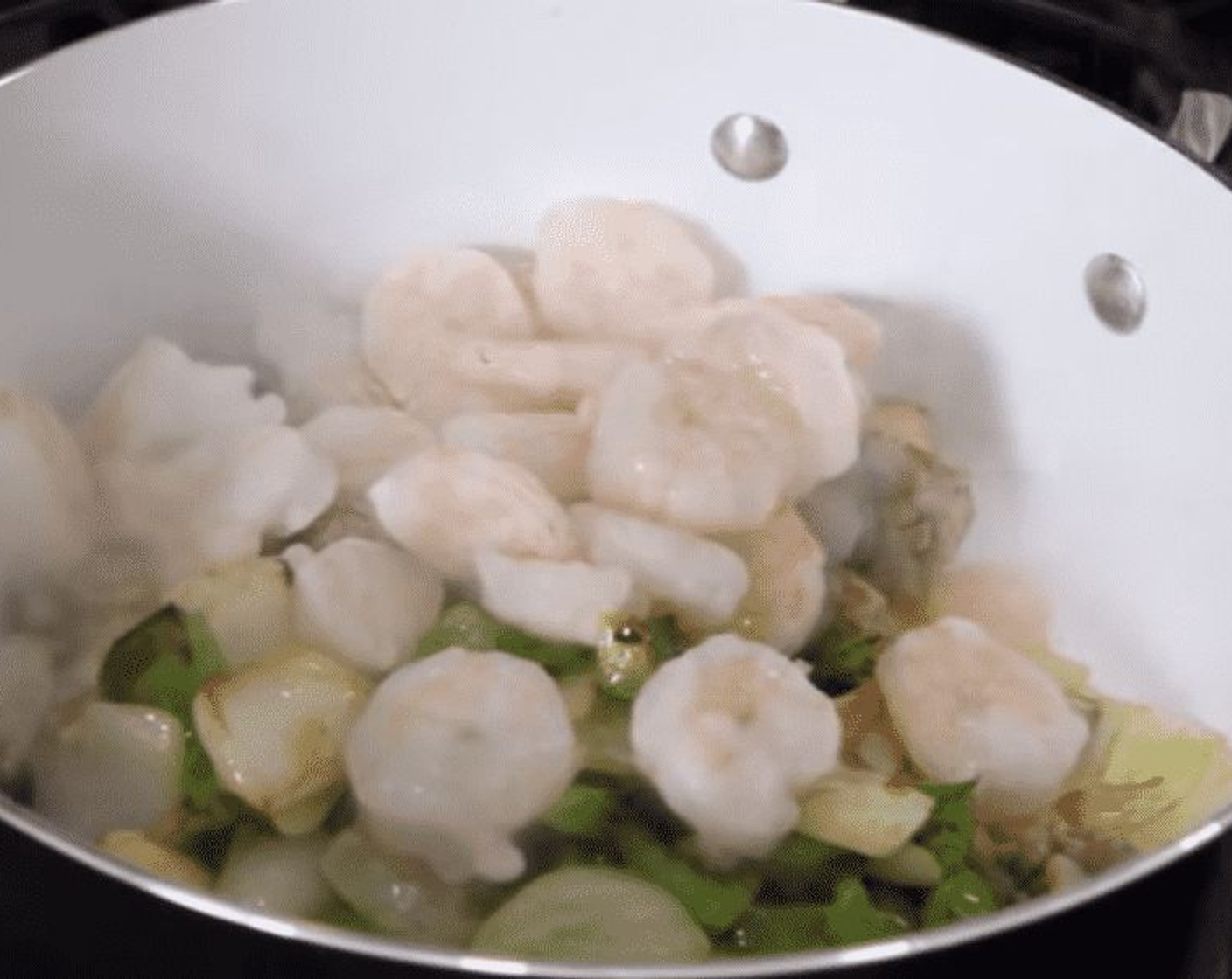 step 5 Add the chicken and sausage to the large pan with the veggies and then add the Shrimp (16).