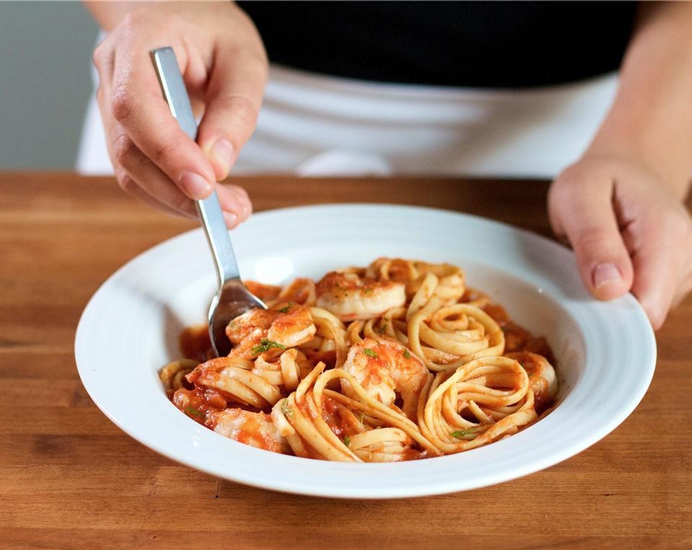 step 10 Place the pasta in the center of two bowls.