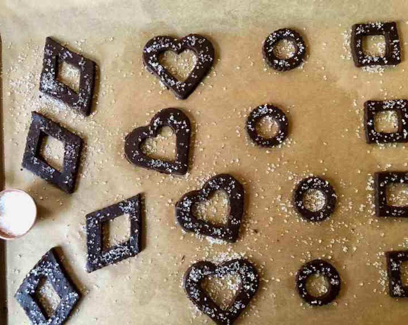 step 10 Sprinkle remaining cut-out cookies with Sparkling Sugar (to taste) then transfer to another parchment-lined baking sheet.