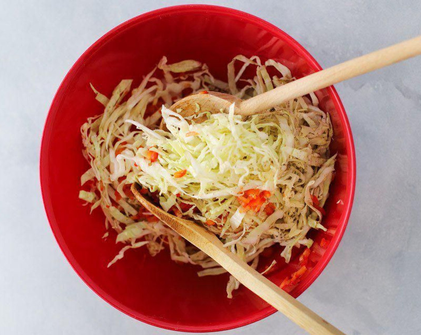 step 1 Add Green Cabbage (4 cups), Red Bell Pepper (1), Distilled White Vinegar (4 Tbsp), Water (2 Tbsp), Granulated Sugar (2 tsp), Celery Salt (1 tsp), and Ground Black Pepper (1/2 tsp) into a medium-sized mixing bowl. Mix with a spoon or spatula until everything is incorporated together.