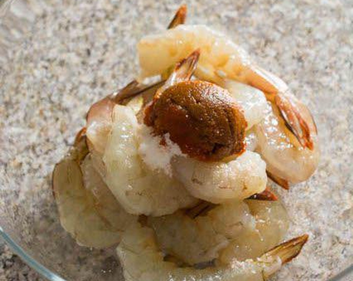 step 1 Pat the Large Shrimp (1 lb) dry with paper towels. Add Tom Yum Chili Paste (1 Tbsp), Granulated Sugar (1 tsp) and Salt (1 pinch) to the shrimp.