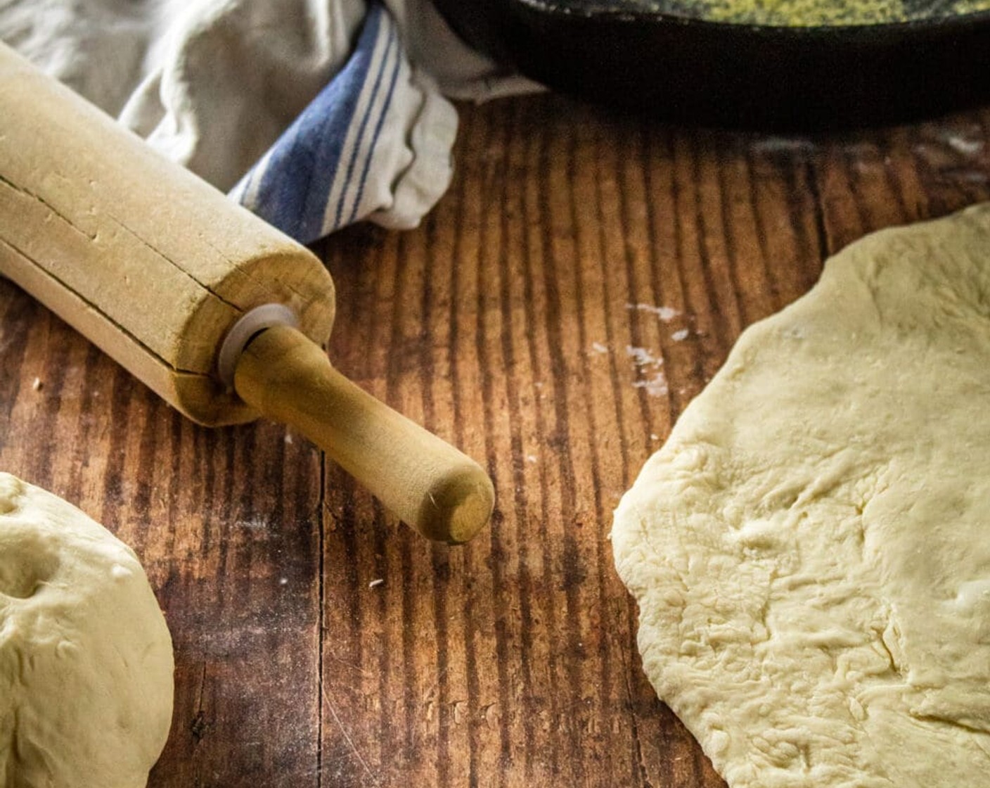 step 6 Cut the dough into two equal pieces. Press one of the rounds of dough into the bottom of the pan, pressing it out towards the edges and up the sides as best as possible.