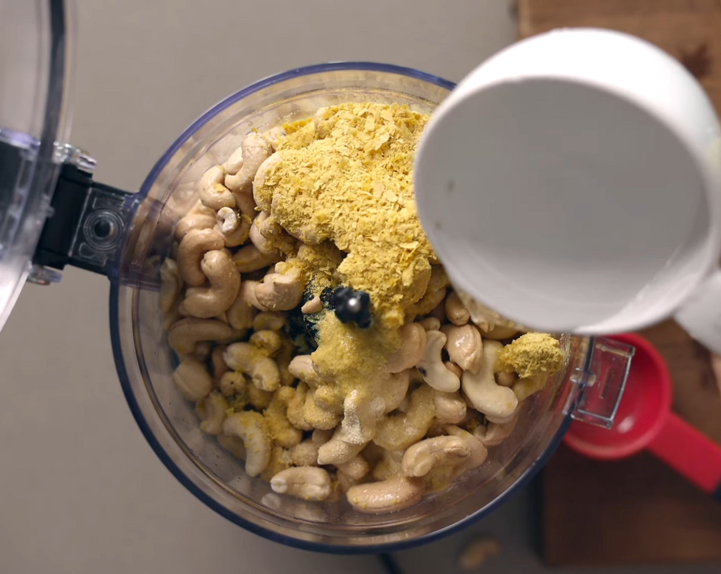 step 2 Discard soaking water from Raw Cashews (3 cups) and add to a high power food processor or blender together with 3 Tbsp of Lemons (2), Nutritional Yeast (1/4 cup), McCormick® Garlic Powder (1 Tbsp), Fine Sea Salt (1/2 tsp), and Water (1 cup). Blend until creamy. Set aside.