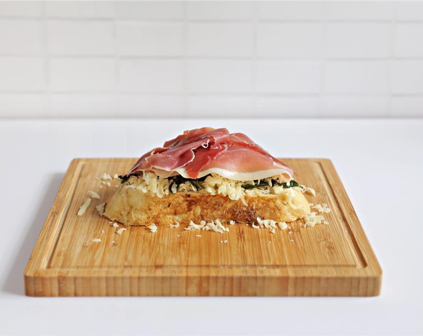 step 4 Add the American Cheese Slice (1) and top with Pancetta (3 slices).
