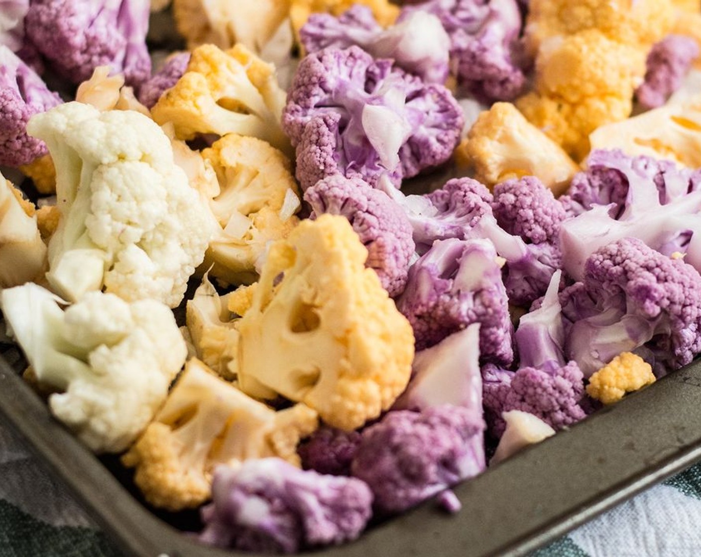 step 2 Add Cauliflower (2 heads) and Sweet Onions (1 1/2 cups) to a baking sheet. Drizzle with Coconut Oil (2 Tbsp). Roast the veggies for 20 minutes.