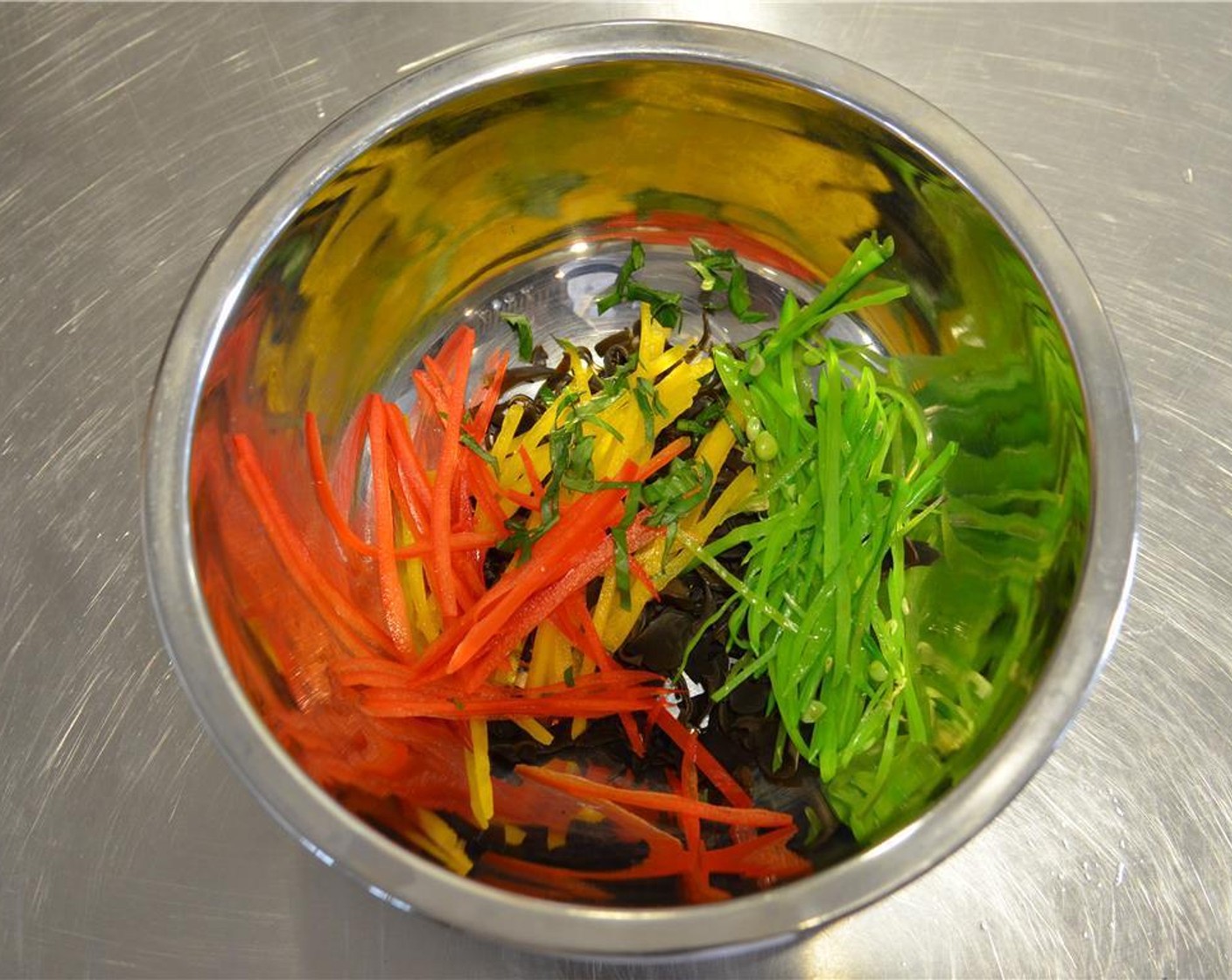 step 3 Seed and cut the Red Bell Pepper (1/2), Yellow Bell Pepper (1/2) into matchsticks. Blanch Snow Peas (5) in salted, boiling water cut into thin strips. Cut the Wood Ear Mushrooms (3 Tbsp) into thin strips. Combine in a bowl and set aside.