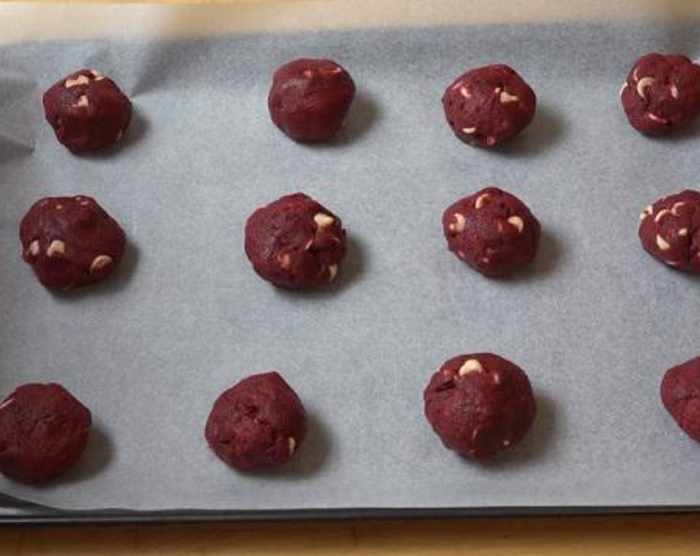 step 5 Roll the dough into a spoon full of small cookie balls. Then, bake the cookies inside a preheated oven for about 10 minutes.