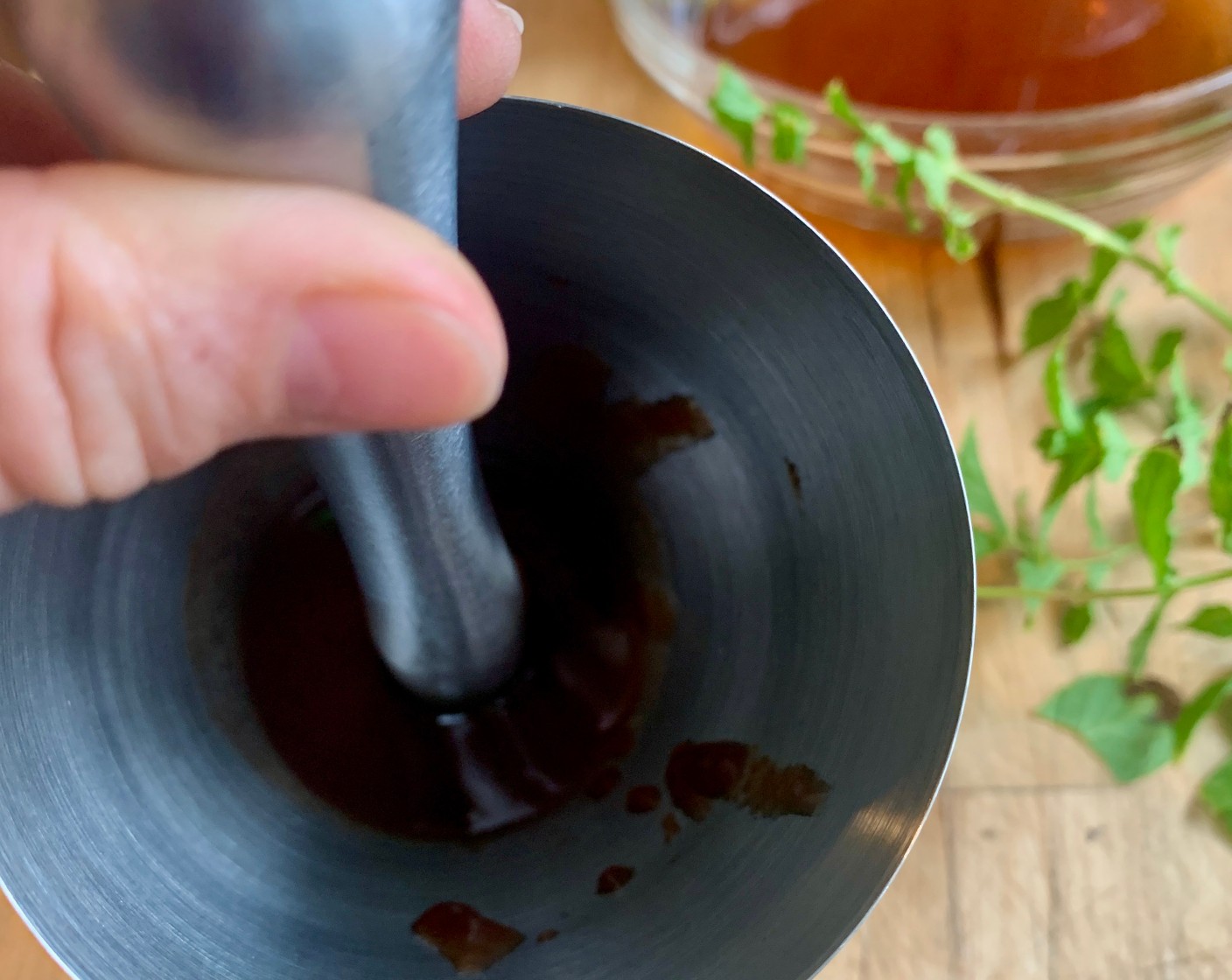 step 2 In the bottom of a cocktail shaker or glass pitcher muddle the Fresh Mint Leaves (6).