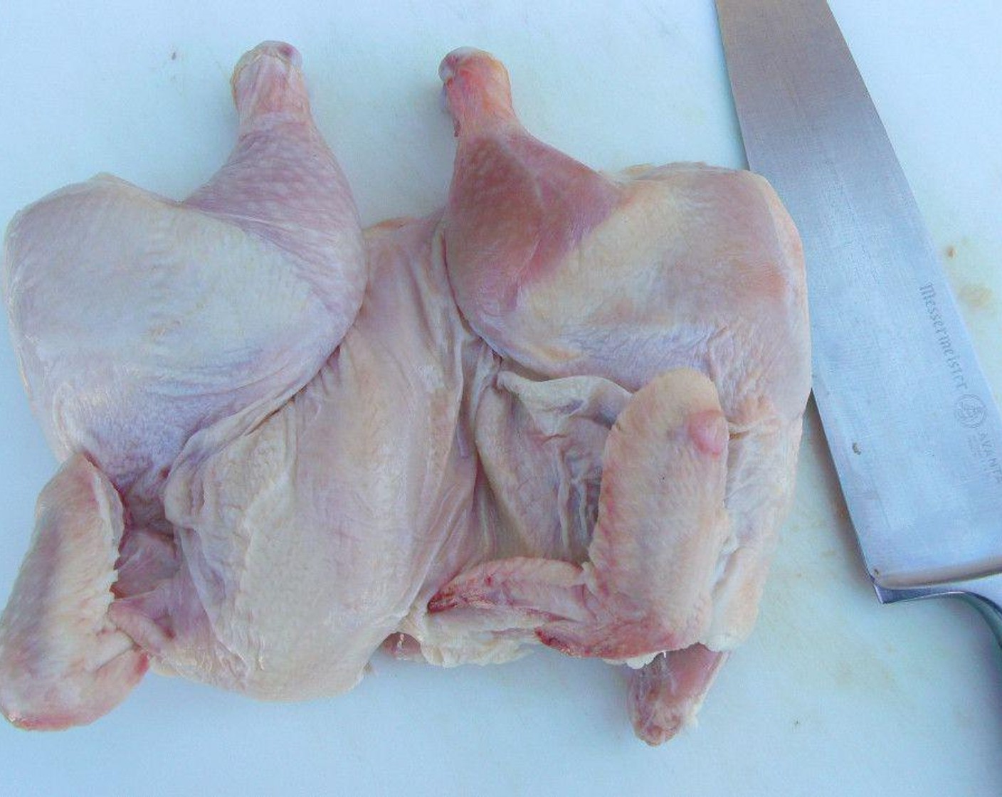 step 3 Cut through back of the hen and season with Kosher Salt (to taste). For a formal dinner, remove back bone and wing tips.