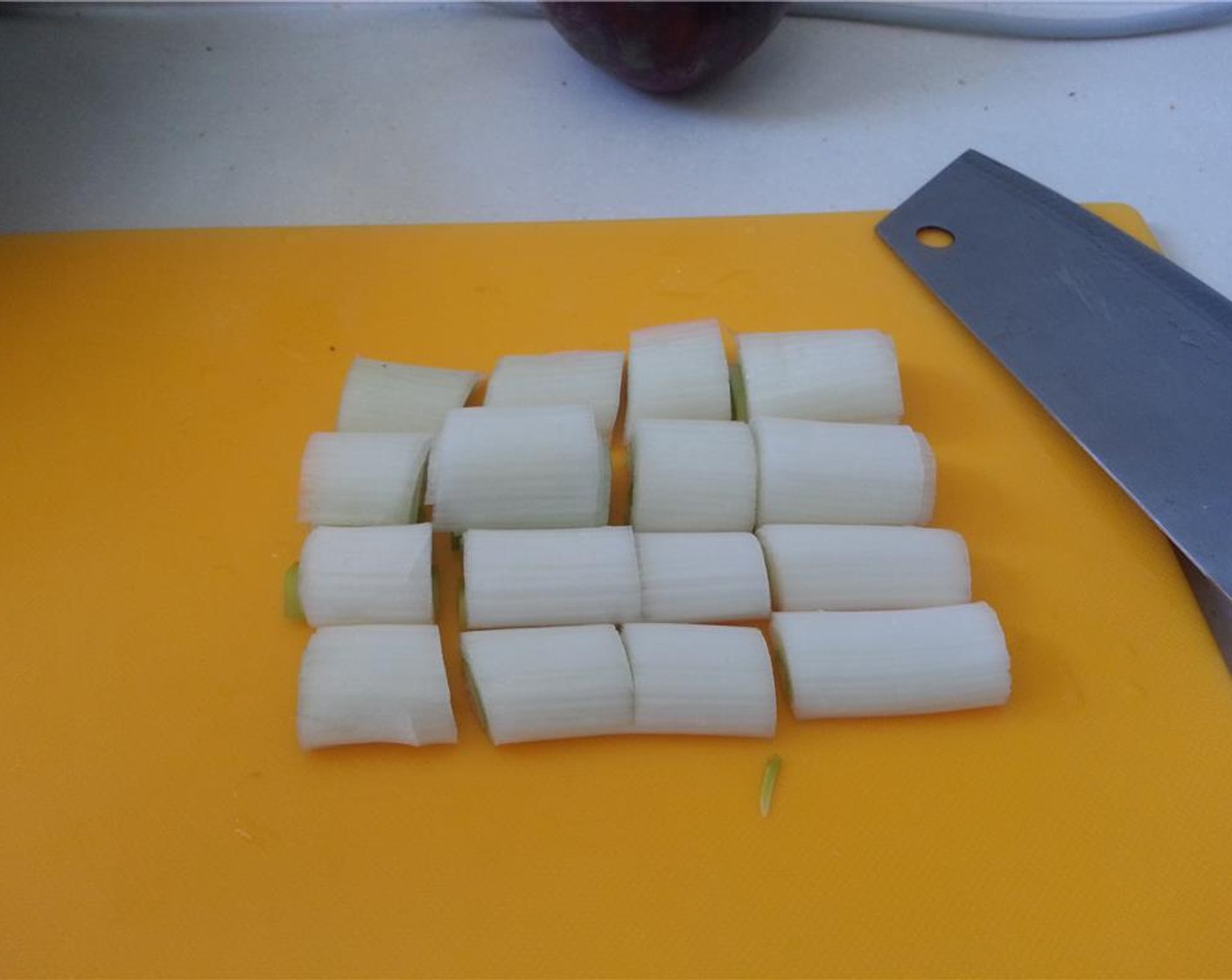 step 3 Remove the green top from the Leek (1 stalk) and roughly chop the white part.