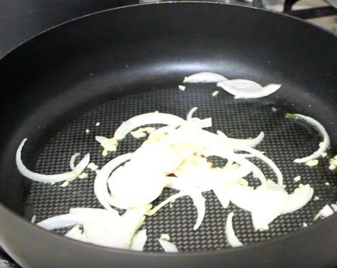 step 1 In a skillet, add Extra-Virgin Olive Oil (2 Tbsp), Onion (1), and Garlic (4 cloves). Cook for 1-2 minutes, or until onion and garlic are fragrant.
